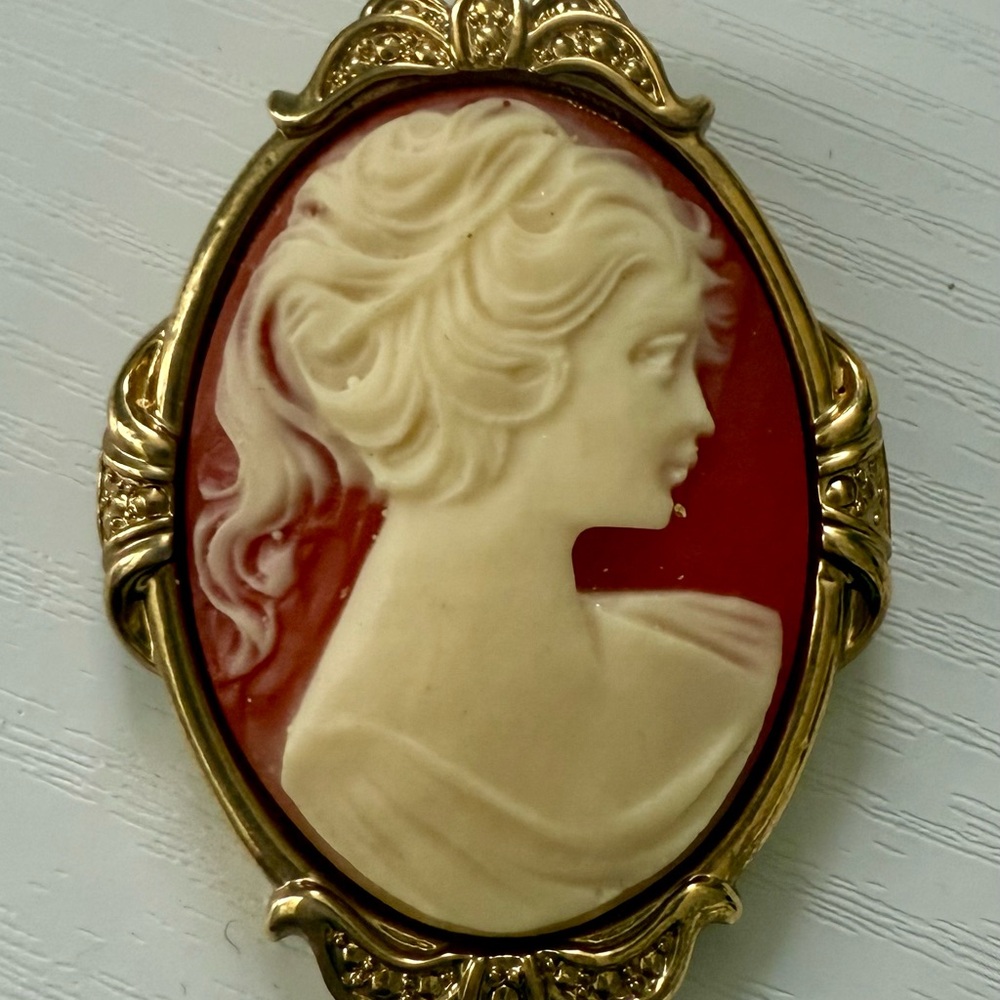 Elegant Gold and Cream Cameo Brooch